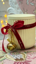 Yellow handmade scented candle with bell and velvet ribbon - Image 2