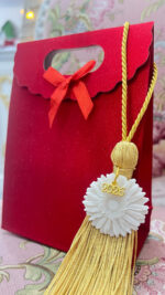 Sunflower ornament made of porcelain with gold tassel - Image 4