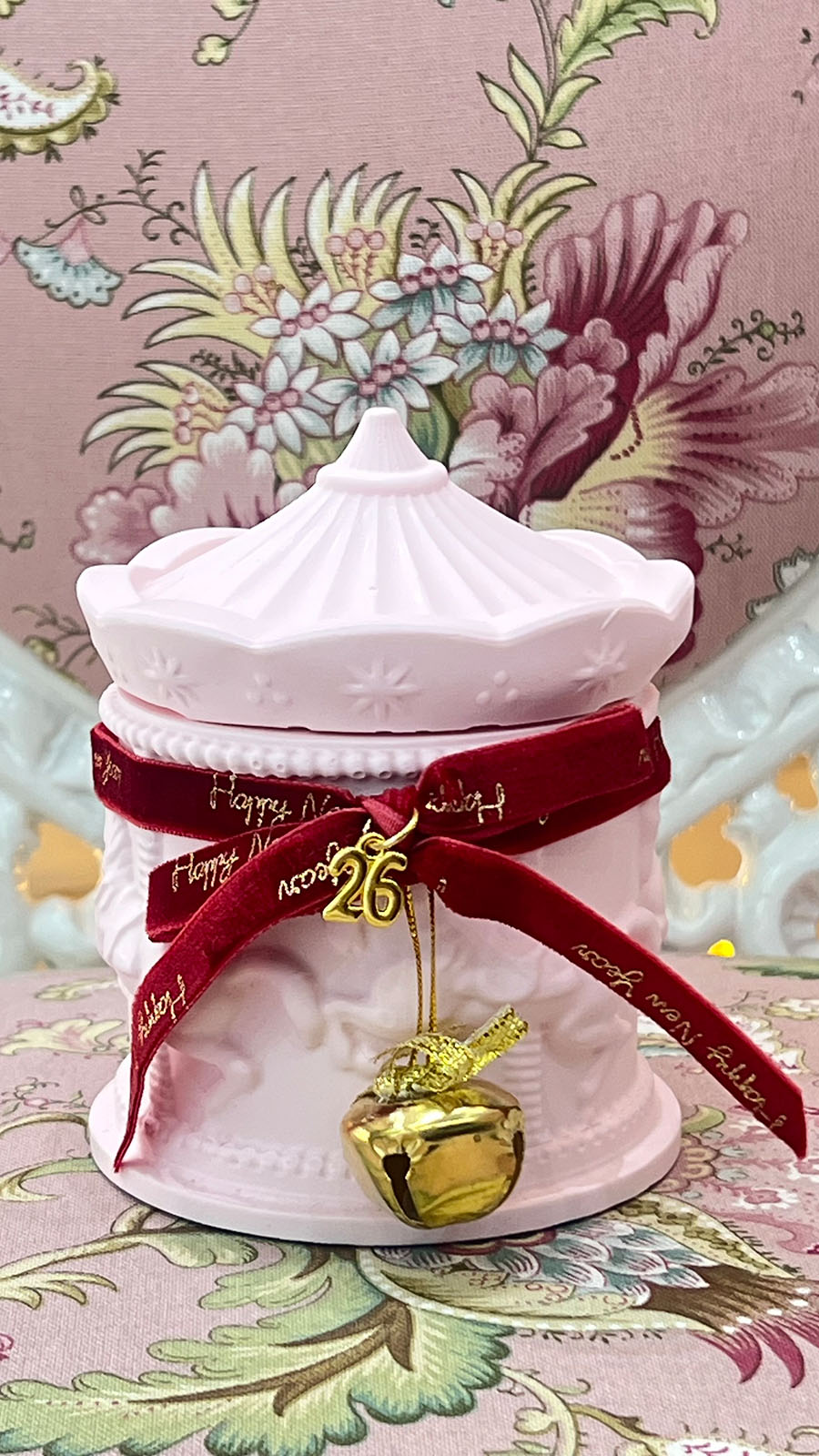roz-carousel-keri Pink handmade scented candle carousel with bell and velvet ribbon - Image 1