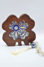 Brown tabletop decorative wooden trefoil with plexiglass and gold leaf