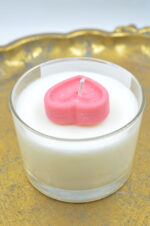 Scented handmade candle in glass with heart