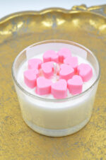 Scented handmade candle in glass with hearts