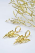 Gold plated angel shaped earrings with zircons
