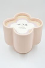 Ceramic flower shape vase with nude candle