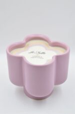 Ceramic flower shape vase with rotten apple candle
